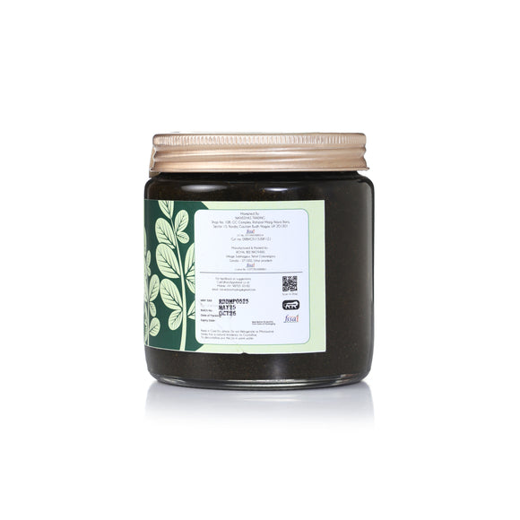 Apidear MoringaPrash jar with green moringa leaves and premium Ayurveda-inspired packaging on a clean background.