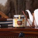 Spoonful of Apidear HoneyNut drizzled over toast or breakfast bowl promoting healthy morning nutrition.