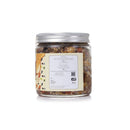 Jar of mixed nuts with a label on a white background